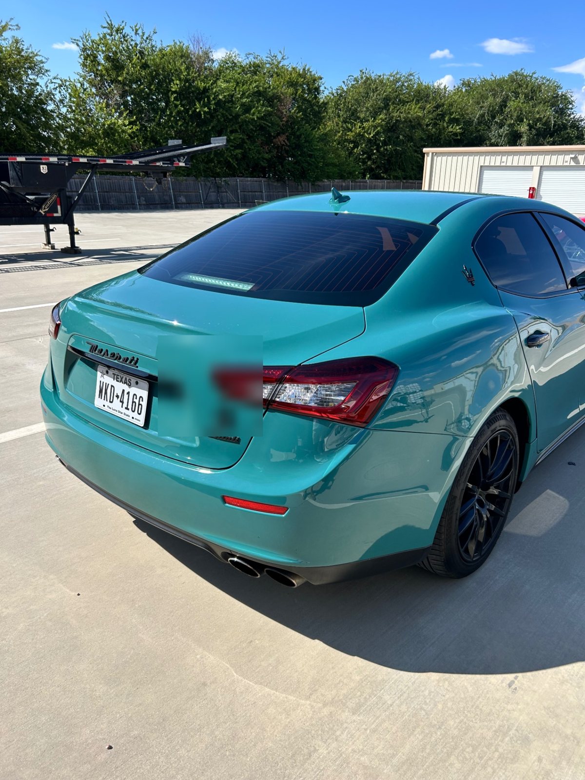 Rear of the teal Maserati Ghibli